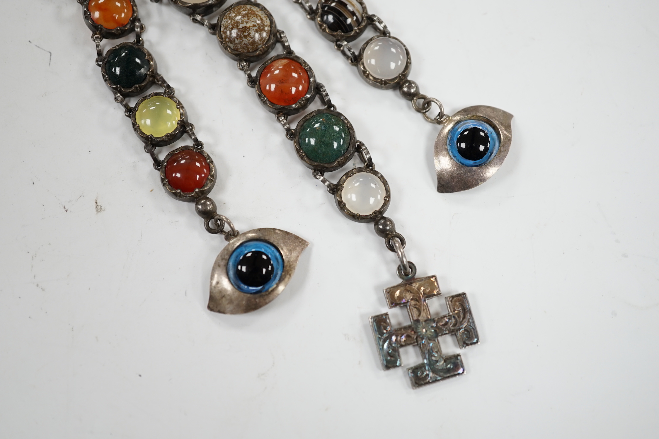 A white metal and cabochon multi gem set chatelaine, including jasper, carnelian and banded agate, 17cm.